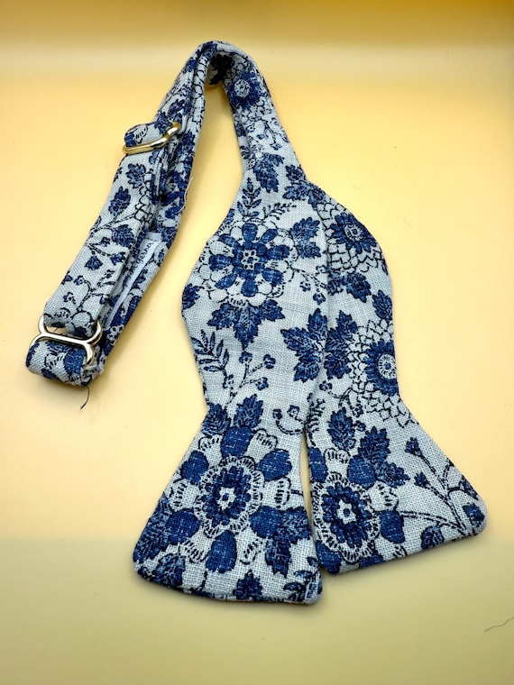 Tan w/ Blue Floral Self Tie Bow Tie w/ brass hardware