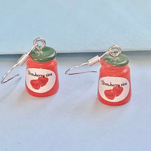 Pendientes colgantes de tarro de mermelada, súper lindos, extravagantes, divertidos y modernos. #amor #amantes de la comida ciruela, albaricoque, fresa.