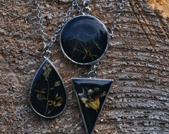 black resin and dried flower pendant