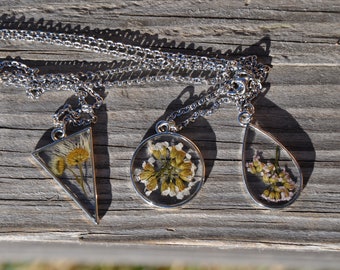 Resin necklace and dried flowers. Dried flower pendant