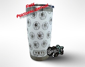 Vaso Yeti de 20 oz con diseño de globo ocular 360, grabado a láser, con tapa magnética. Disponible en varios colores.