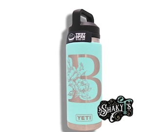 26oz - Floral Monogram laser engraved on a Yeti bottle/rambler with chug cap or matching straw lid.