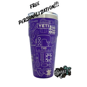 May include: Purple Yeti tumbler with a white design of sewing tools and the text "YETI" and "FRAN". The tumbler is personalized with a white design of sewing tools and the text "YETI" and "FRAN".