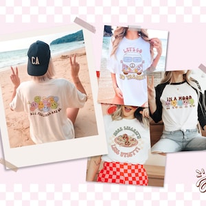 Op de afbeelding: Een collage van vijf verschillende T-shirt-ontwerpen met verschillende illustraties en tekst. De ontwerpen omvatten een regenboog van smiley-gezichten met de tekst "Alle gevoelens zijn ok&eacute;", een vintage busje met de tekst "Laten we naar het strand gaan", een groep smiley-gezichten met de tekst "In een bui", een bord spaghetti met de tekst "Meer spaghetti, minder stress" en een krabbel van een smiley-gezicht met een hart en een pijl.