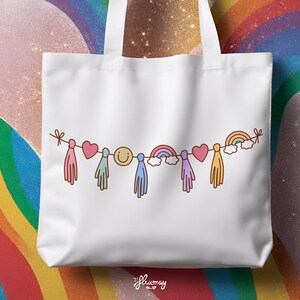 May include: White tote bag with a rainbow garland design. The garland features a smiley face, hearts, rainbows, and tassels.