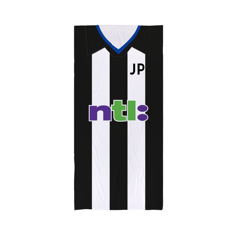 May include: Black and white striped soccer jersey with a blue collar and a green and purple "ntl" logo. The jersey has a white nameplate with the initials "JP" on it.
