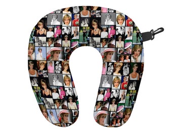 May include: A black and white travel pillow with a collage of images of Princess Diana. The pillow is shaped like a horseshoe and has a strap to secure it around the neck.
