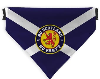 May include: A triangular pet bandana with a navy blue background and white diagonal stripes, resembling the Scottish flag. The center features a circular emblem with the text "NO SCOTLAND NO PARTY" and a red lion on a yellow background.