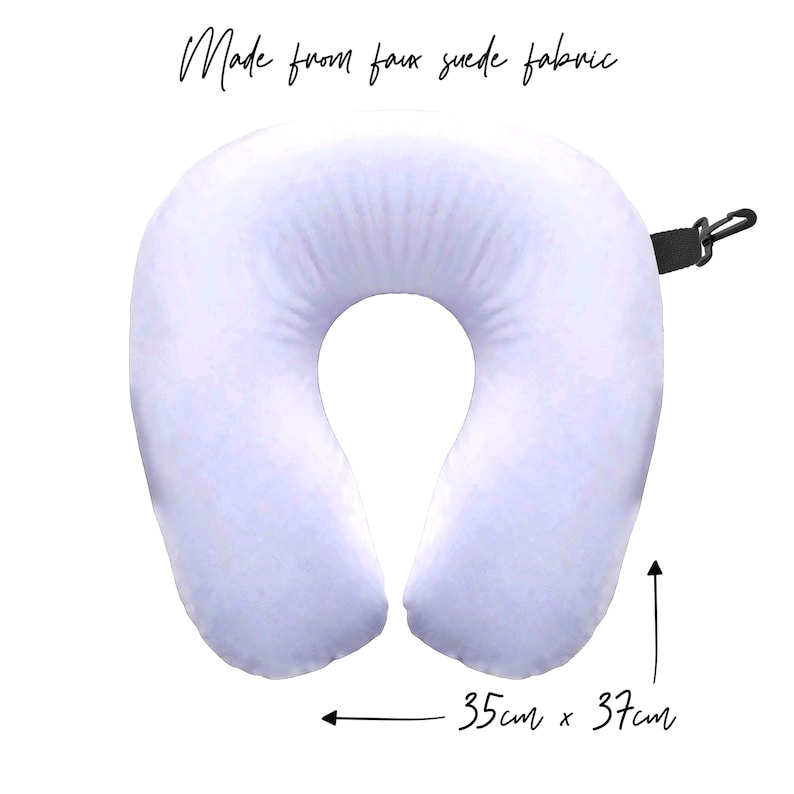 May include: A light purple travel neck pillow made from faux suede fabric. The pillow measures 35 inches by 37 inches.