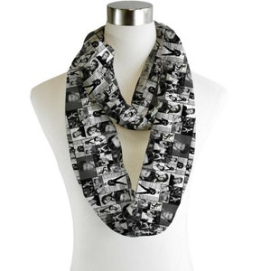 May include: A black and white infinity scarf with a pattern of many small squares, each containing a different black and white photo of a man.