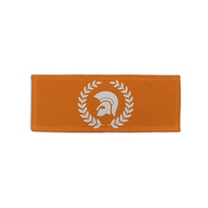 Op de afbeelding: Oranje stoffen patch met een wit Mod-doellogo in een lauwerkrans.