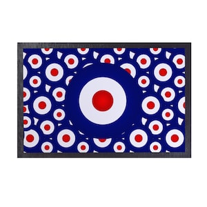 May include: A framed print featuring a repeating pattern of red, white, and blue target designs. The targets are arranged in a random pattern on a dark blue background.