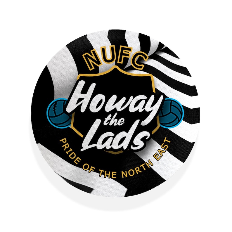 May include: Round black and white graphic with the text "NUFC Howay the Lads Pride of the North East". The design includes a shield shape with text and two teal soccer balls.