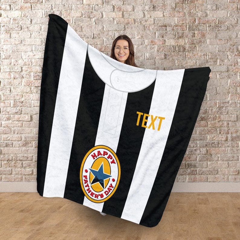 May include: Black and white striped blanket with a collar design. Features a yellow and blue emblem that says "HAPPY FATHER'S DAY" and the word "TEXT" in yellow.