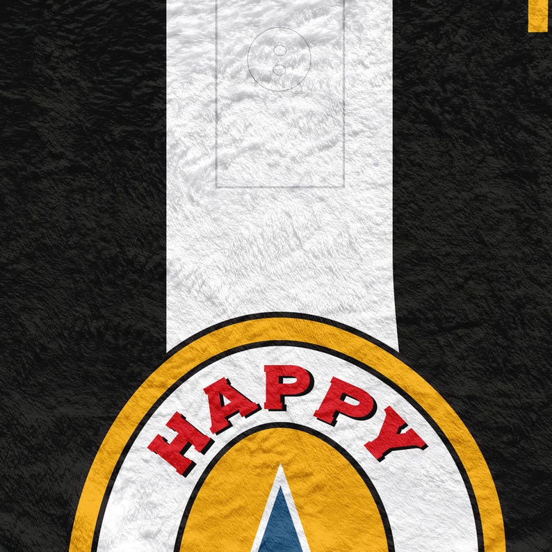 May include: A close-up of a black and white patterned textile with a yellow and red circular design. The design features the word "HAPPY" in red block letters. A blue triangle is visible within the yellow circle.