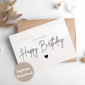 May include: A white card with black text that says "Von Herzen Happy Birthday" with a small black heart. The card is on a brown envelope and there is a white background.