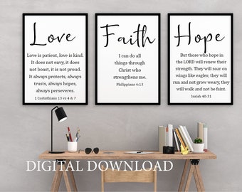 May include: Three black framed prints with white backgrounds and black text. The prints feature the words "Love", "Faith", and "Hope" with bible verses underneath each word.