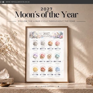 Puede incluir: Una impresión de calendario 2027 Moon's of the Year enmarcada que presenta doce ilustraciones circulares en acuarela para cada mes, con iconos de fases lunares y etiquetas de texto para cada mes en un formato de cuadrícula sobre fondo blanco.