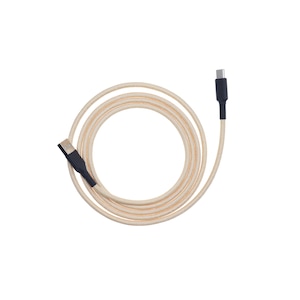 May include: A beige and orange braided USB-C charging cable with black connectors. The cable is coiled in a circular pattern against a white background. The cable is designed for charging and data transfer.