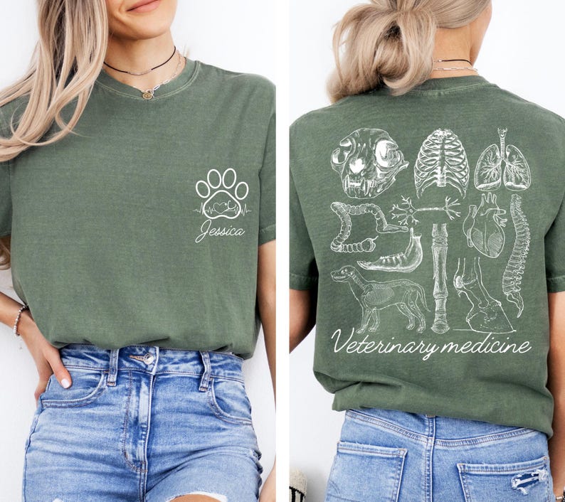 May include: Green t-shirt with a white paw print and heartbeat graphic on the front and a white graphic of animal anatomy on the back. The text "Veterinary medicine" is printed on the back of the shirt.