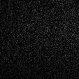 May include: Close-up of a black leather texture. The leather has a fine grain and an uneven surface, with subtle variations in tone and texture. The lighting highlights the natural imperfections of the material.