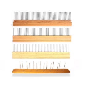 May include: Four wooden combs with metal teeth. The combs are arranged vertically, with the top comb having the most teeth and the bottom comb having the fewest. The combs are all made of natural wood and have a light brown color.