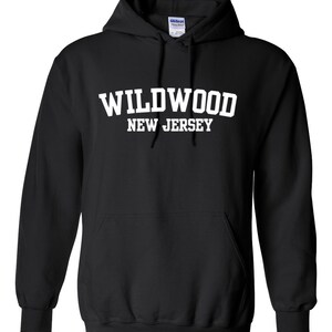May include: Black hooded sweatshirt with white text that reads "WILDWOOD NEW JERSEY".