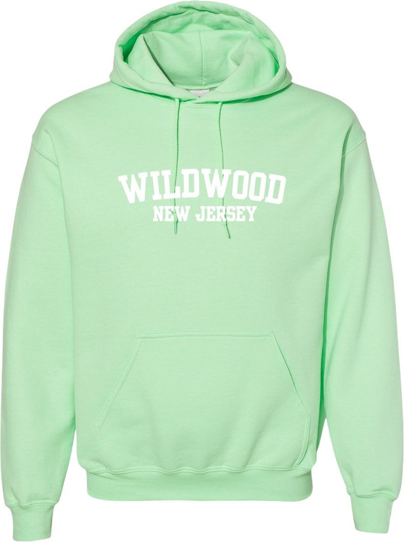 May include: A light green hooded sweatshirt with the text "WILDWOOD NEW JERSEY" in white.