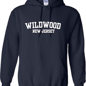 May include: Navy blue hooded sweatshirt with white text that reads "WILDWOOD NEW JERSEY".