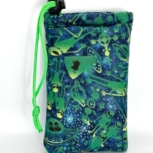 May include: A drawstring pouch with a vibrant alien-themed design. The fabric features a dark blue background with green and yellow alien illustrations, planets, and stars. A bright green drawstring and cord lock secure the top. The pouch is designed to hold small items.