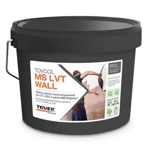 May include: A black bucket of TOVCOL MS LVT WALL adhesive. The label shows a person applying the adhesive to a wall. The text on the label includes "Mono-component MS Polymer adhesive for LVT and SPC on wall."