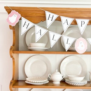 Pink pastel Halloween ghost paper decoration printable made into a Happy Halloween letter garland with ghosts