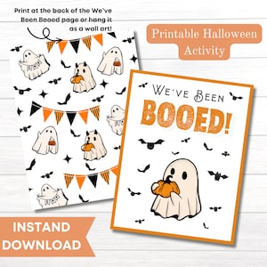 May include: Printable Halloween activity card with a ghost holding a pumpkin. The card says "We've Been Booed!" and has a background of bats and orange and black bunting. The back of the card has a repeating pattern of ghosts, bats, and bunting.