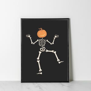 Framed dancing skeleton with orange pumpkin head on black background; funny Halloween wall art, digital download.