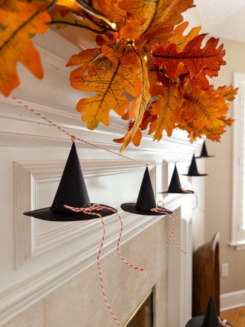 Witch hat printable template, Halloween DIY paper hat, witch party craft idea, printable Halloween banner, witch hat decoration for mantel, spooky witch hat garland, cute Halloween paper craft, witch hat DIY decor, Halloween witchy printable, festive witch hat artwork