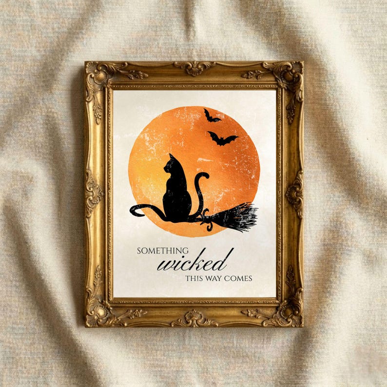 Black cat Halloween quote print in an ornate gold vintage frame on a linen background