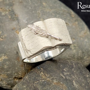 Old Book with feather Pen Ring