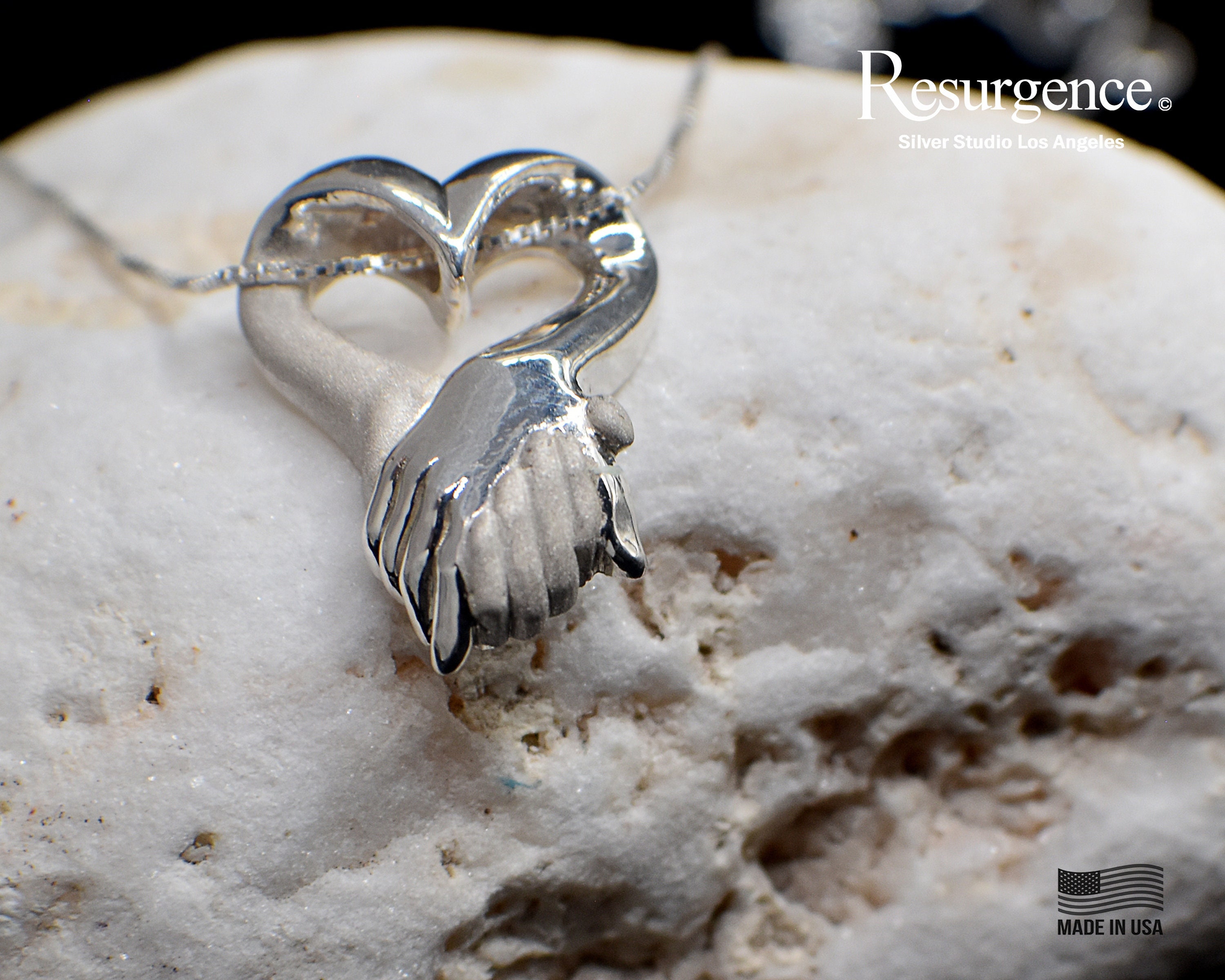 Hand Holding Heart Necklace