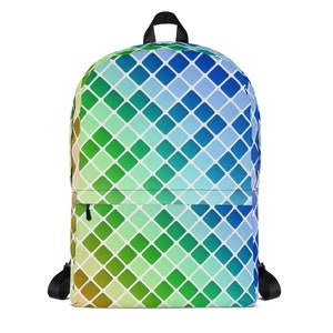 Könnte beinhalten: Ein blauer, grüner und gelber Rucksack mit geometrischem Muster. Das Muster besteht aus kleinen Quadraten, die in einem diagonalen Muster angeordnet sind.