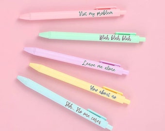 May include: Five pastel-coloured pens with humorous phrases written on them. The phrases are "Not my problem", "Blah blah blah", "Leave me alone", "How about no", and "Shh... No one cares".