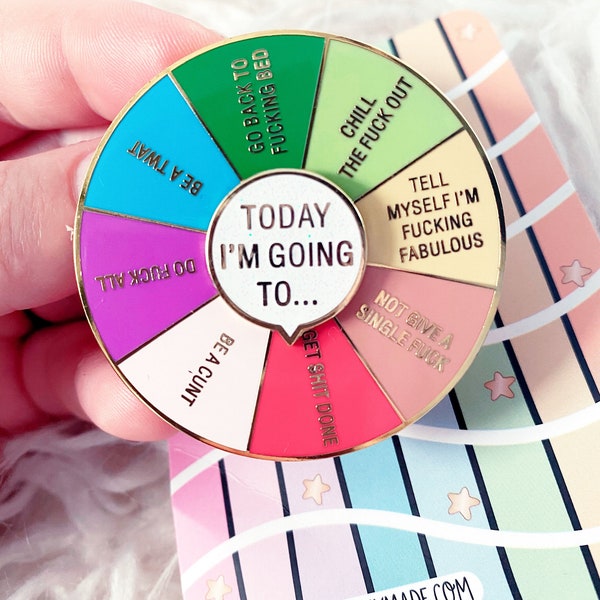 Spin wheel pin badge