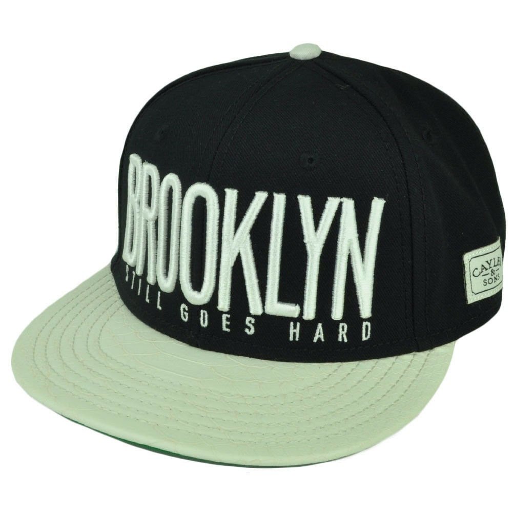 Cayler And Sons Brooklyn Still Goes Hard Black White  Flat Bill Snap Buckle Hat Ca