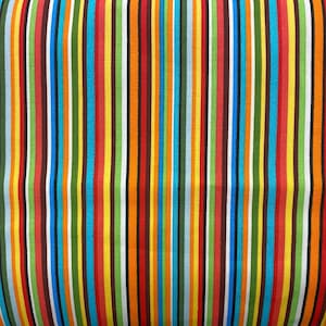 May include: A colorful striped fabric with alternating red, orange, yellow, green, blue, and white stripes.