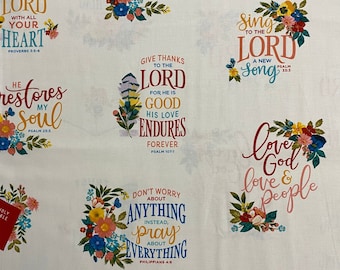 May include: A white fabric with colorful floral designs and inspirational quotes about faith and love. The quotes include "Trust in the Lord with all your heart", "He restores my soul", "Give thanks to the Lord", "Don't worry about anything instead, pray about everything", "Sing to the Lord a new song", "Love God, love people".