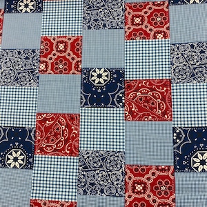 May include: Red and blue patchwork fabric with a checkered pattern. The fabric features a repeating pattern of red and blue bandanas with white accents.