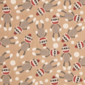 May include: Tan fabric with a repeating pattern of gray sock monkeys wearing red hats. The monkeys are in various positions and have white feet.