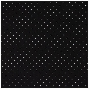 May include: Black fabric with a white polka dot pattern.