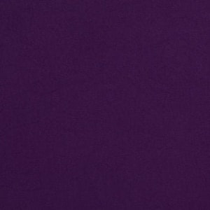 May include: A solid purple fabric swatch. The fabric has a smooth, even texture.