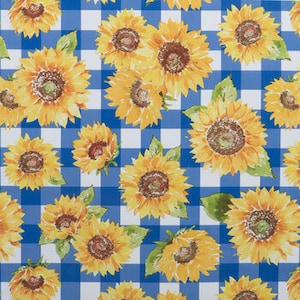 May include: A blue and white gingham fabric with a repeating pattern of yellow sunflowers. The sunflowers have green leaves and brown centers.