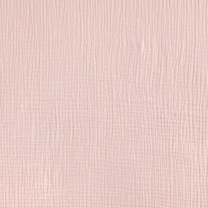 May include: A close-up of a pale pink fabric with a textured, woven pattern.